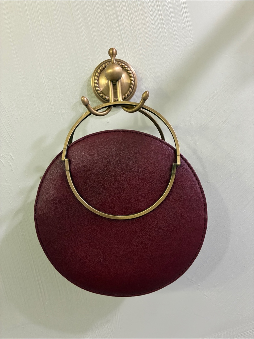 Anthropologie Round Crossbody Bag in Burgundy with Gold Accent